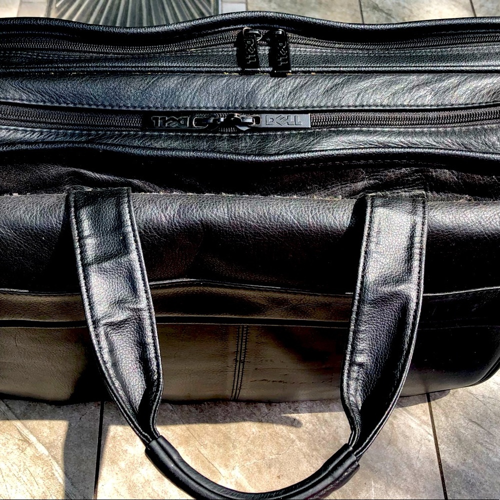 Dell leather computer bag with three pockets.